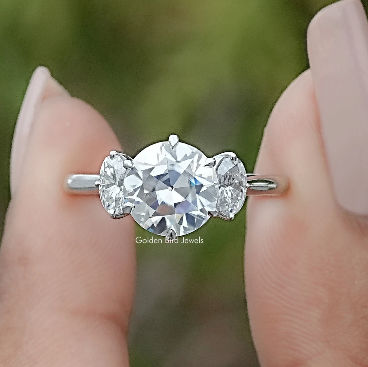 Front view of Old European Round Oval Moissanite Three Stone Ring