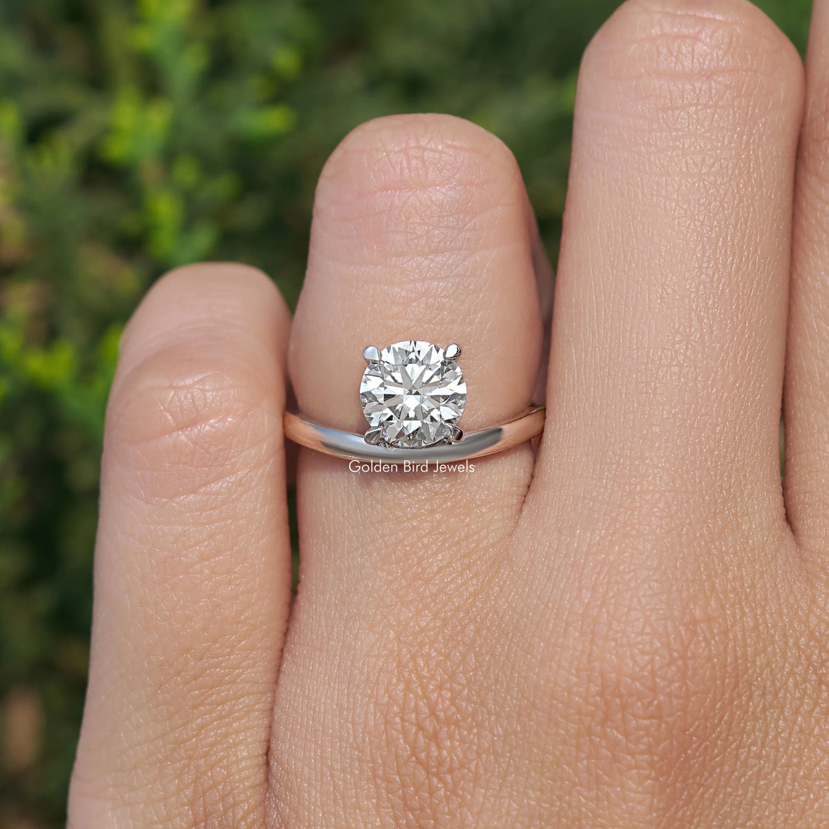 Silver curved solitaire ring with large round lab diamond on finger