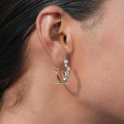 Side View of Bezel Set Diamond Huggie Hoop Earrings In Ear's