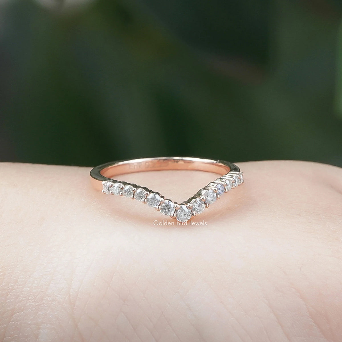 Chevron eternity band ring with round lab diamonds, top view on palm