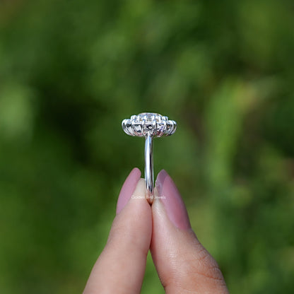 Side view of silver round halo ring with sparkling band and prongs