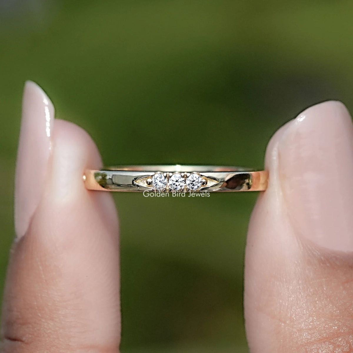 Yellow gold-tone eternity band with round-cut lab diamonds, thin profile