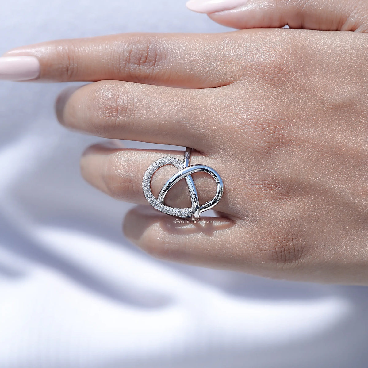 Lab diamond criss-cross loop ring on a hand