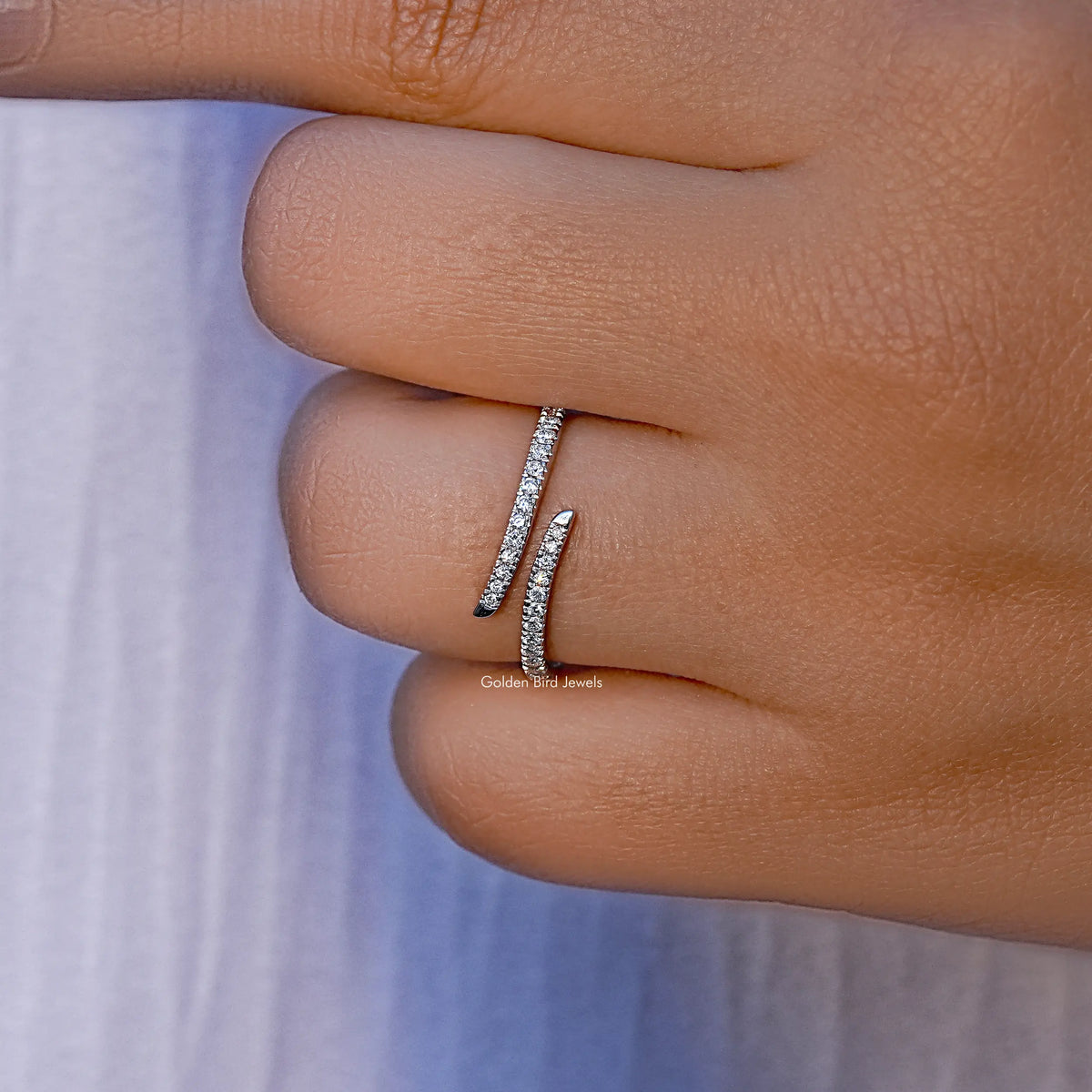 Side view of open cuff ring with round cut lab diamonds in pave