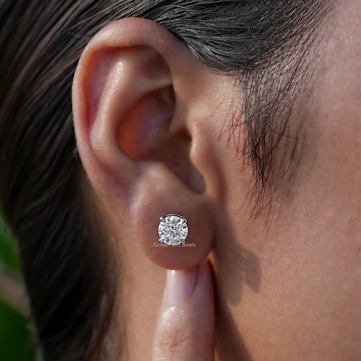 Side View of white lab diamond solitaire earings 