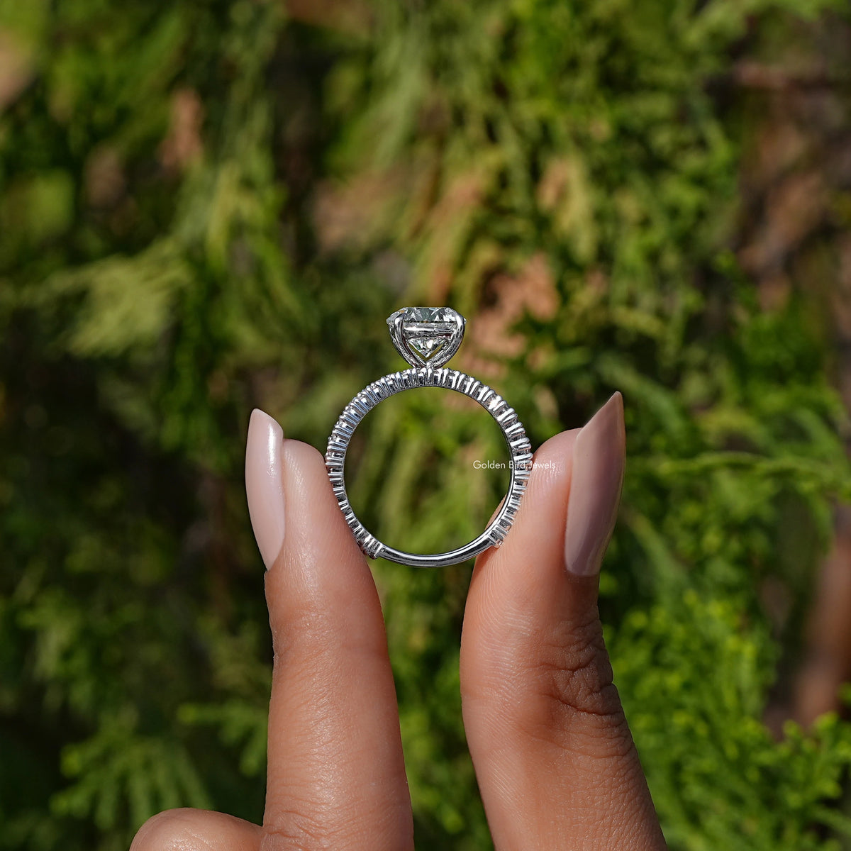 Back View of A Round Cut Diamond Wedding Ring Set in two fingers