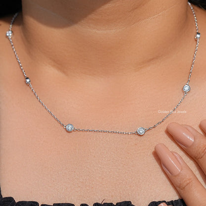 Silver chain necklace with three round lab diamond-like bezel stones on choker length