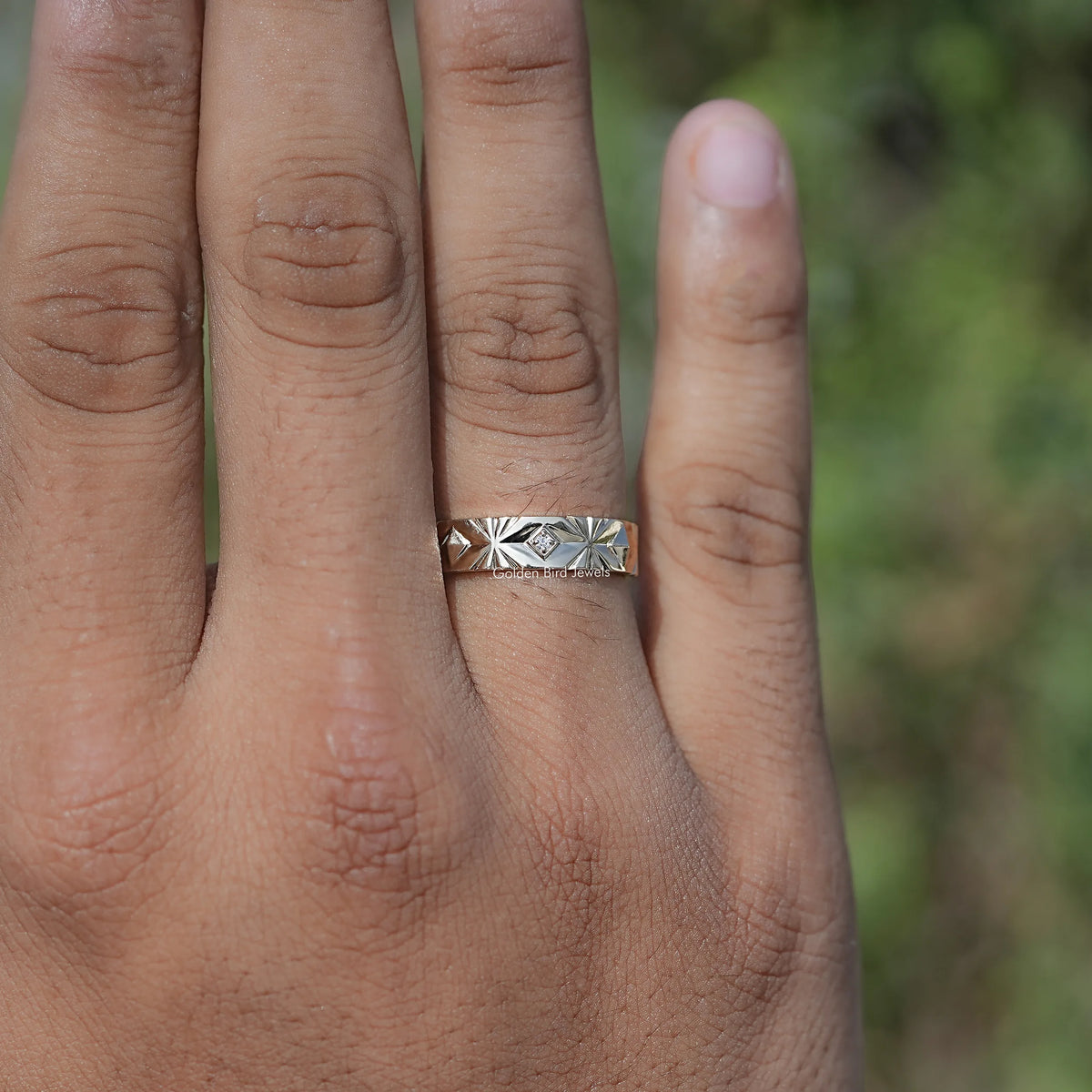 Silver men’s lab-diamond ring on hand, flat band with starburst prong detail