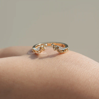 Gold-tone open cuff stacking band ring with round lab diamonds, angled on skin