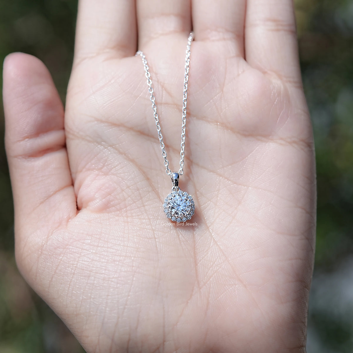 In Hand Showing of Lab Grown Round Cut Diamond Halo Pendant