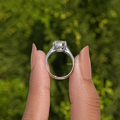 Sterling silver engagement ring showing prong-set round center moissanite and band detail