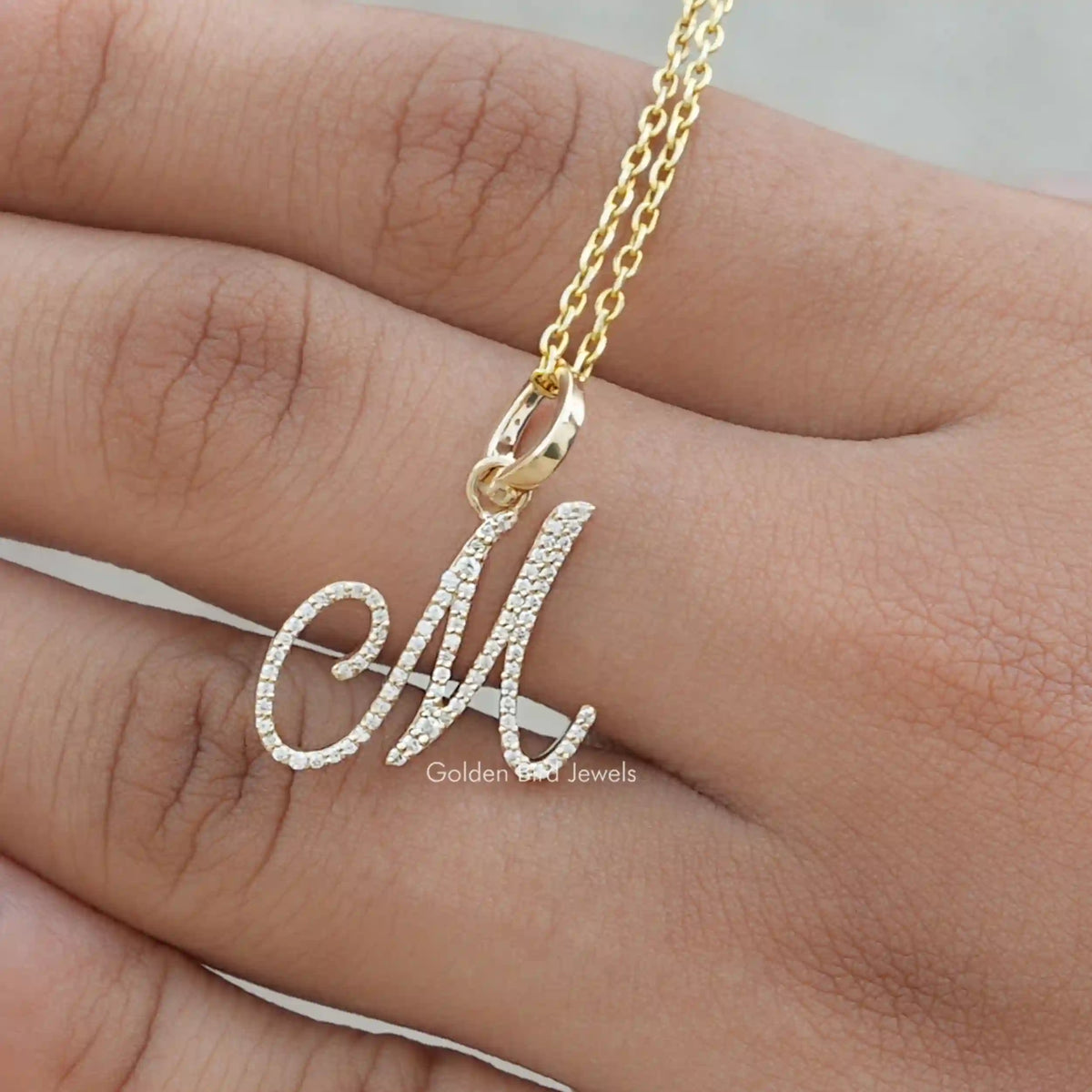 In hand showing view of moissanite pendant	