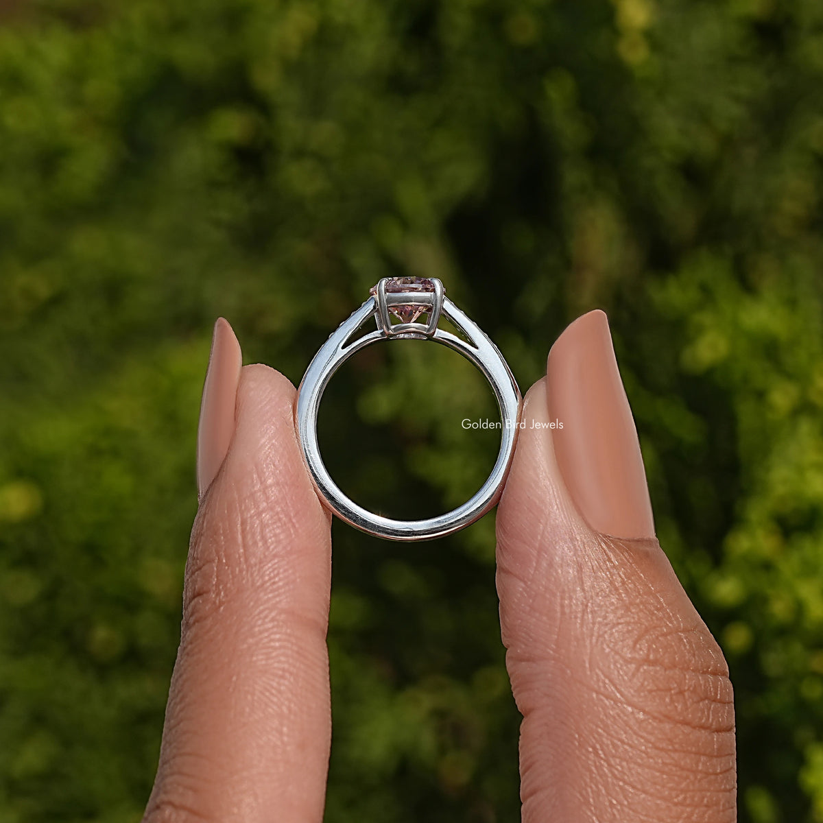 Sterling silver ring with round center moissanite and square halo, prong set