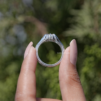 Round-cut moissanite engagement ring top view, prong-set round center stone