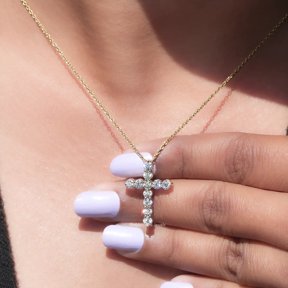 In hand showing view of moissanite pendant	 		