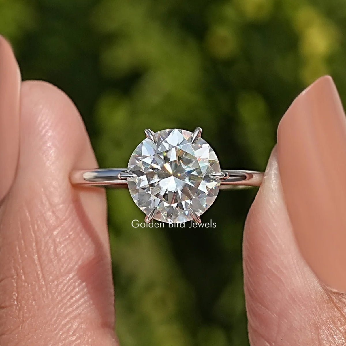 Round-cut moissanite solitaire bridal ring in sterling silver, 4-prong head