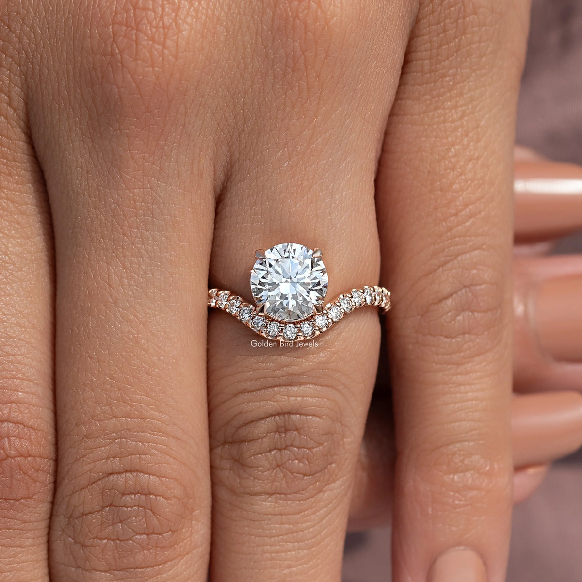 Lab grown round cut engagement ring with curved pavé band and round center stone