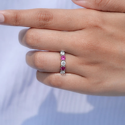 In finger front view of Round Gemstone Wedding Band in unique shape
