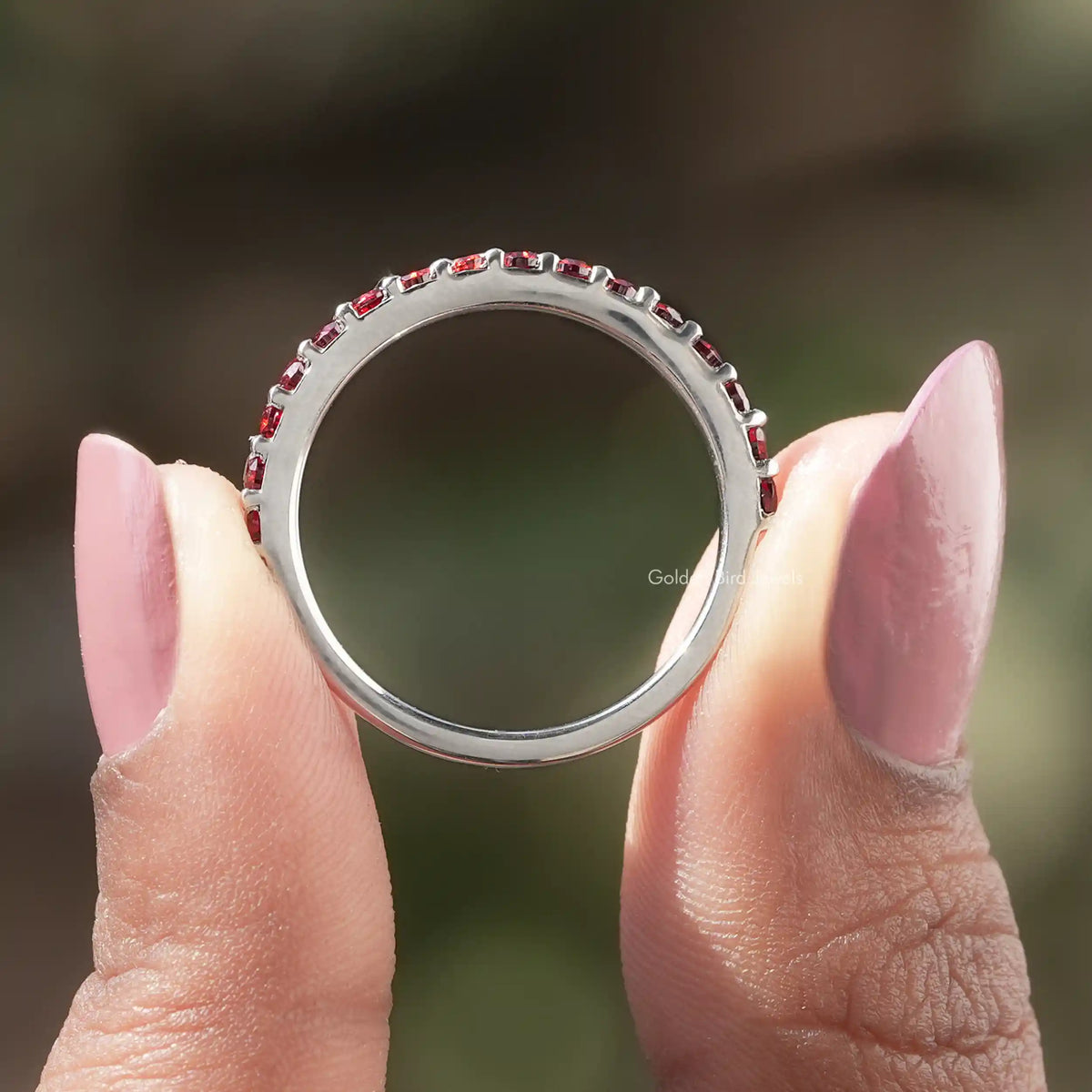 Back view of Round Cut Moissanite Eternity Band in secure setting