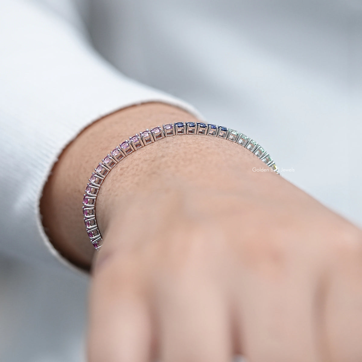 Multi-color gemstone tennis bracelet, curved row of multicolor stones on wrist