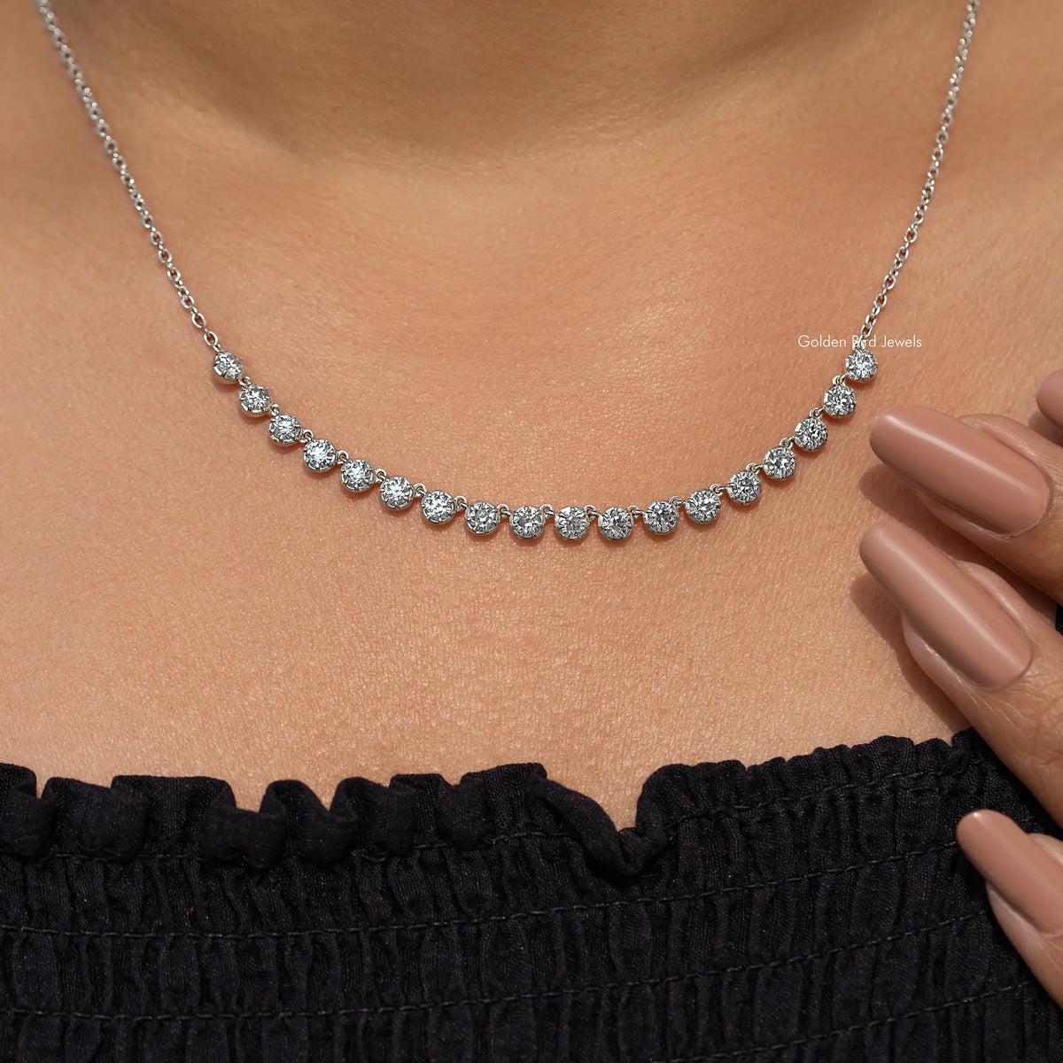 Silver-tone tennis necklace with round-cut moissanite stones along the neckline