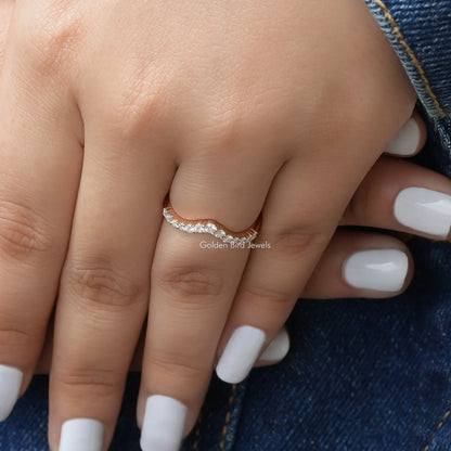 Chevron eternity band ring with round lab diamonds, close-up on finger