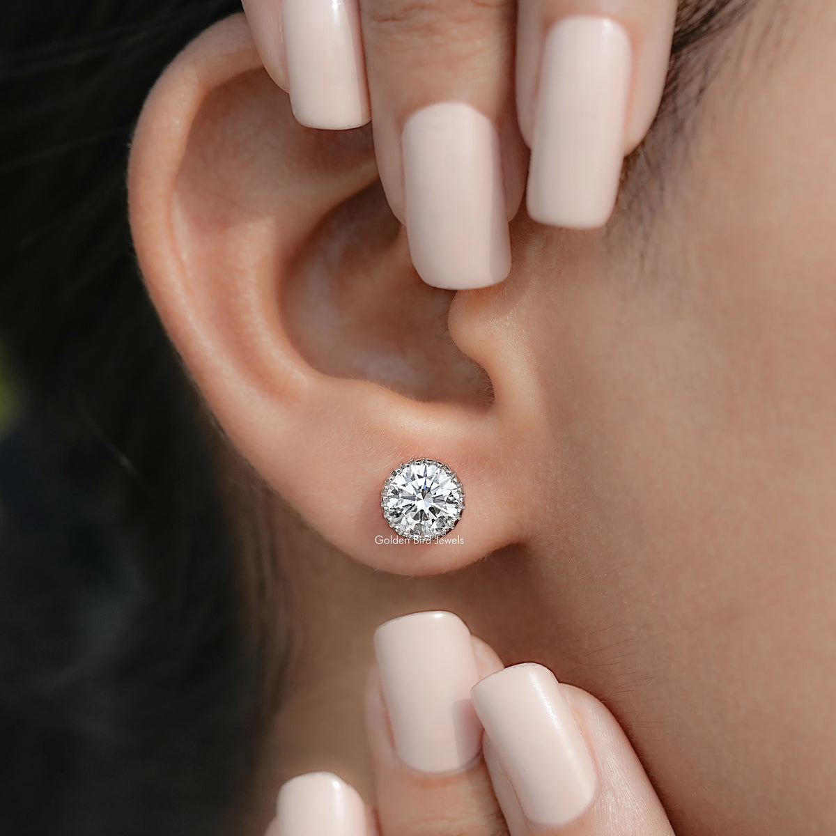Detailed view of Diamond earrings in secure setting 