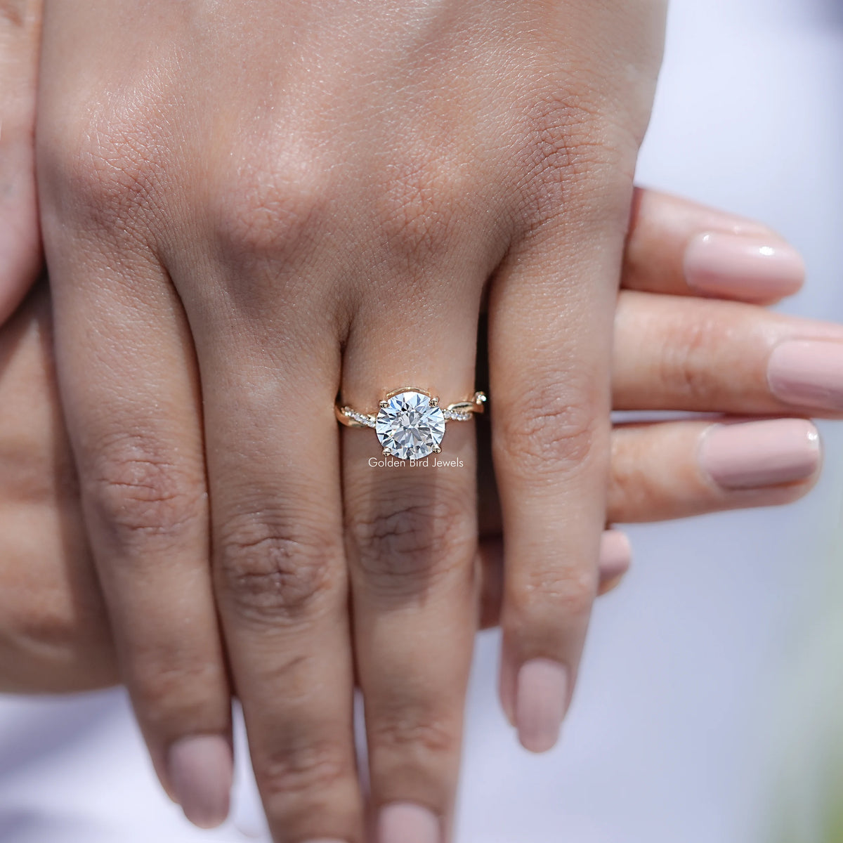 Round lab-grown diamond ring on hand, twisted shank with prong-set center