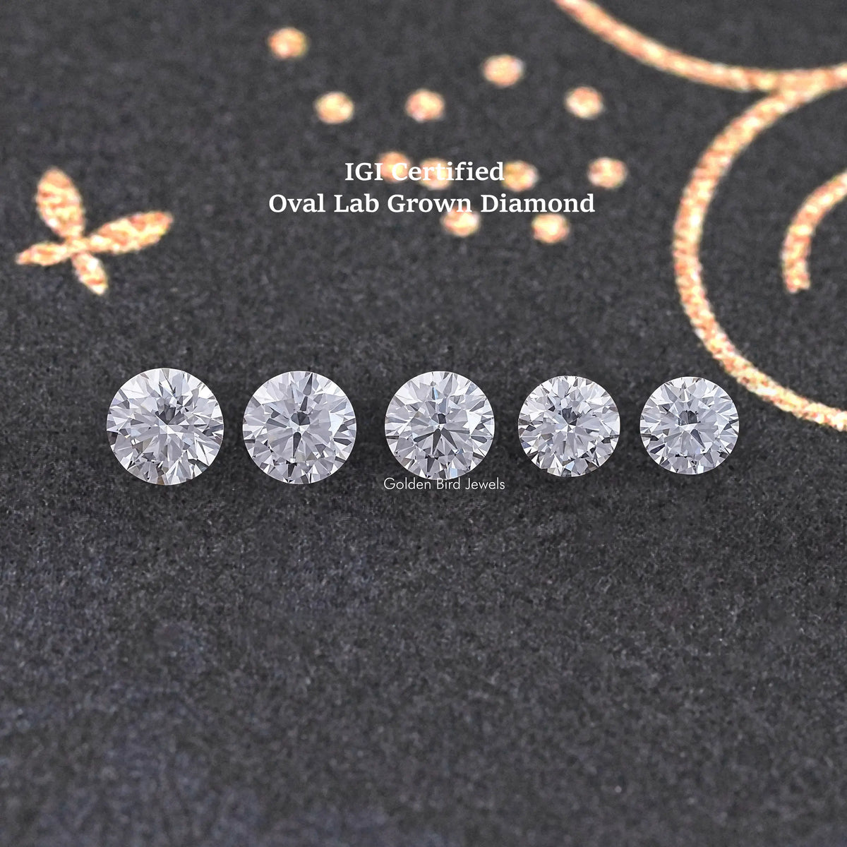 Loose round-cut lab-grown diamonds, five round stones on dark fabric