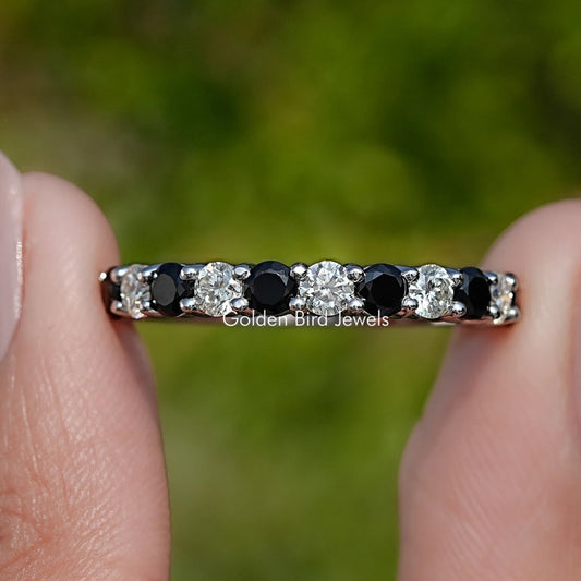 Silver round-gem eternity band with alternating clear and black stones
