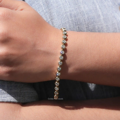 Moissanite bezel setting tennis bracelet with round stones, wrist side view