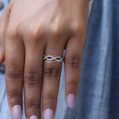 Silver infinity eternity band ring with round sparkling stones on hand