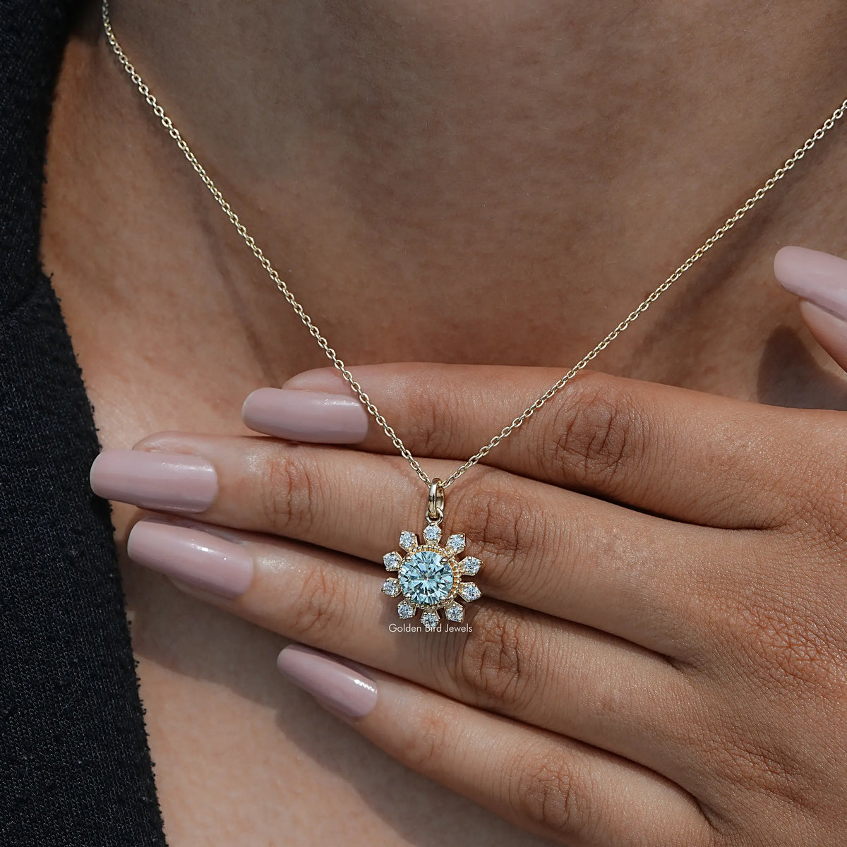 In hand showing view of moissanite pendant