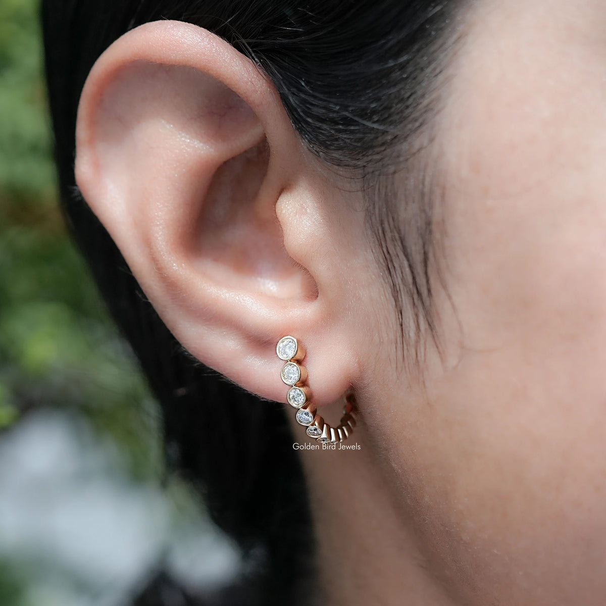 Front View Of Round Cut Moissanite Graduated C Hoop Earrings
