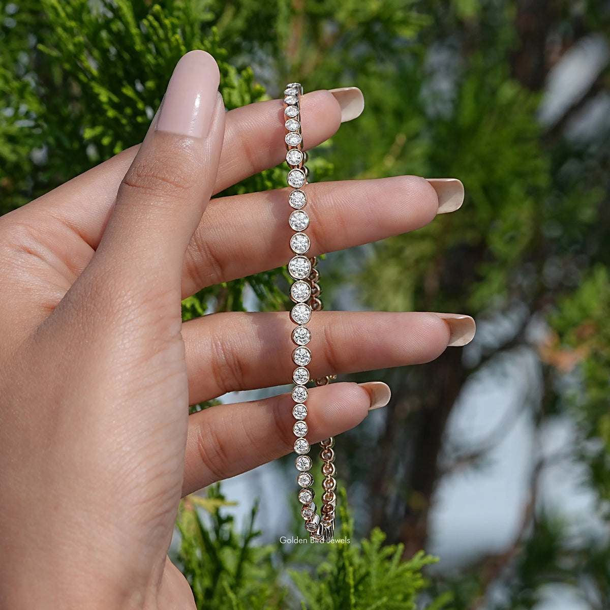 In hand view of moissanite tennis bracelet 
