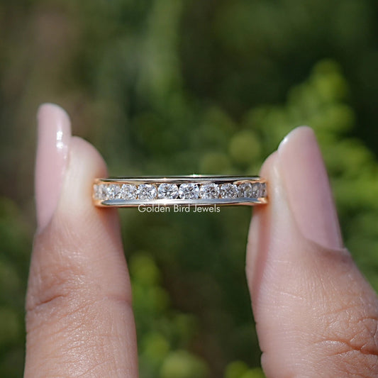 Silver half-eternity channel-set ring with row of round moissanite stones