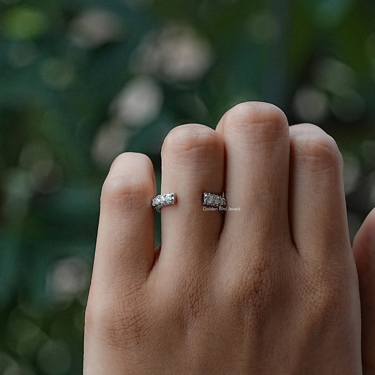 Open moissanite eternity band ring with round stones, silver-tone, stacked look on hand