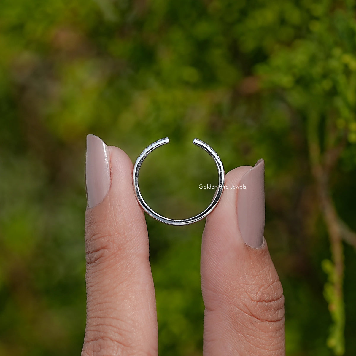 Silver-tone open cuff band ring, side view with round stone border