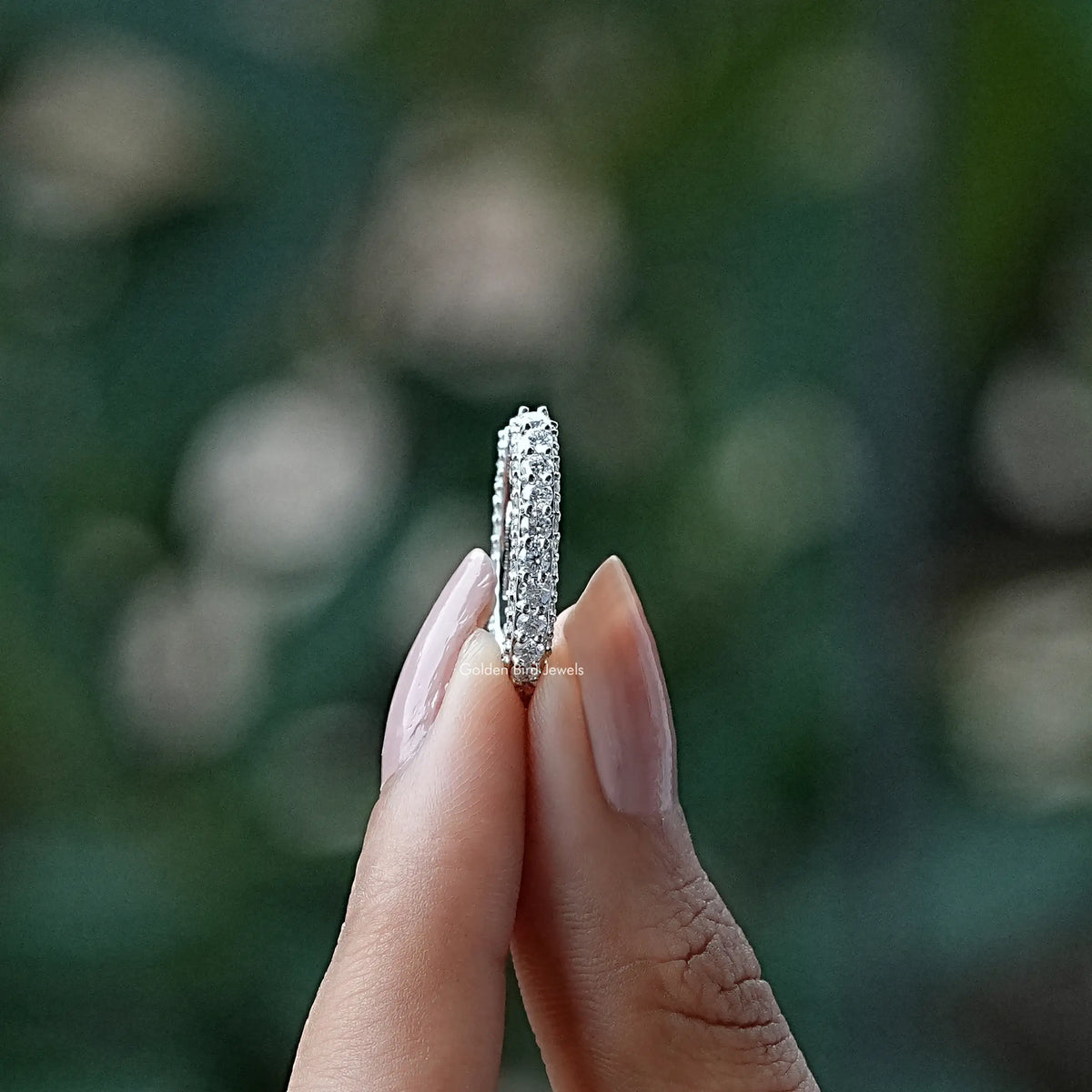 Open moissanite eternity band ring with round stones, silver-tone, vertical close-up
