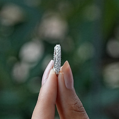 Open moissanite eternity band ring with round stones, silver-tone, vertical close-up