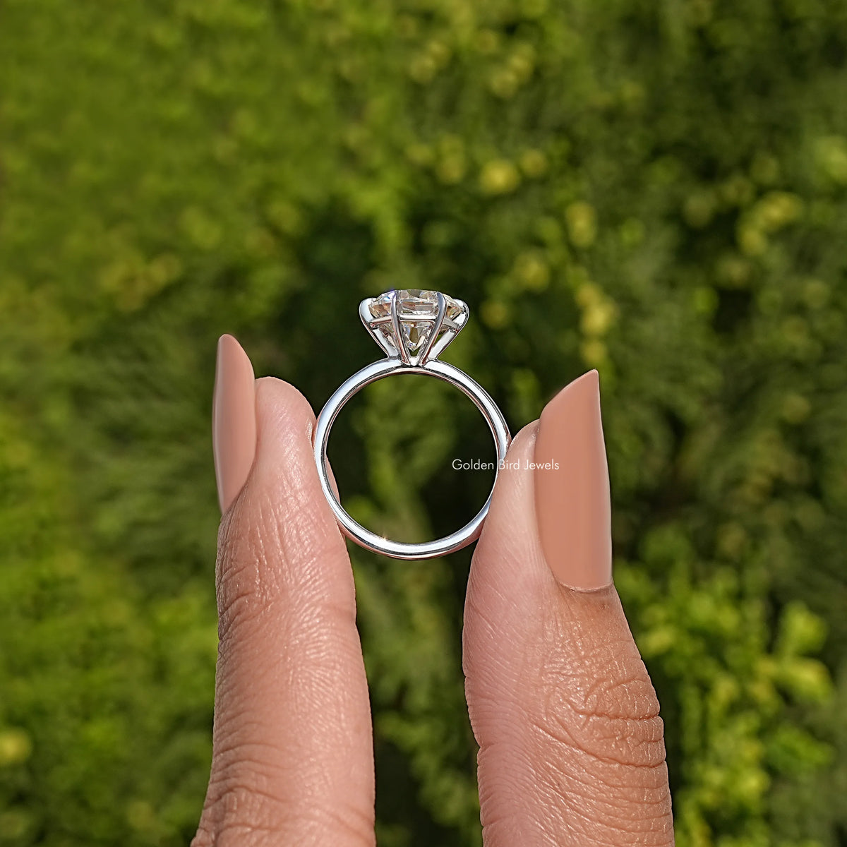 Sterling silver moissanite solitaire ring with round center stone and prong setting