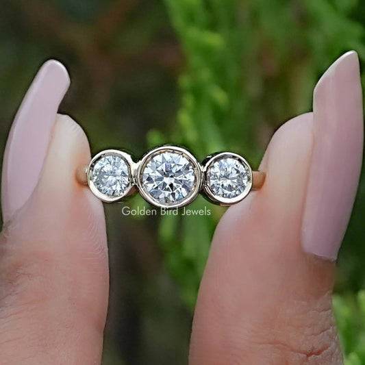 Front view of Round Moissanite Three Stone Bezel Set Ring