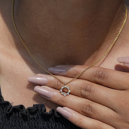 Close-Up View of Round Cut Diamond Pendant In Yellow Gold