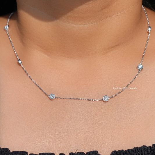 Silver thin chain necklace with round lab diamond bezel stones at spaced intervals