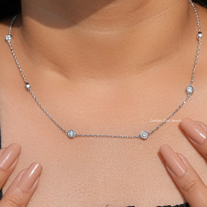 Silver round lab diamond station necklace with three sparkling circular settings