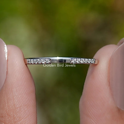 Round moissanite open cuff band with pavé stones on a thin silver setting