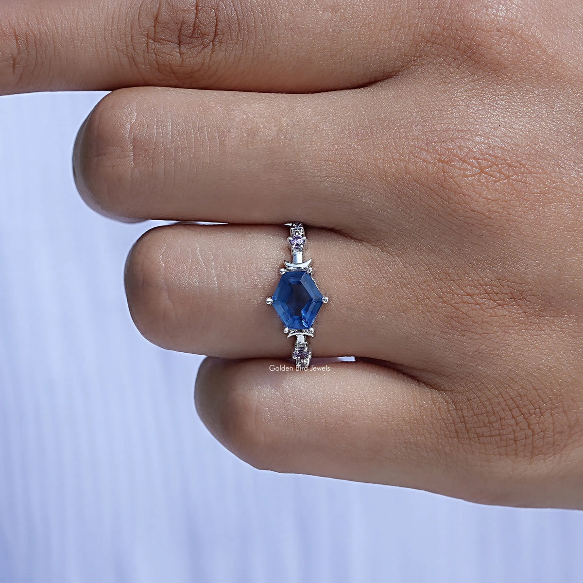 View of Hexagon Cut Gemstone Ring In finger