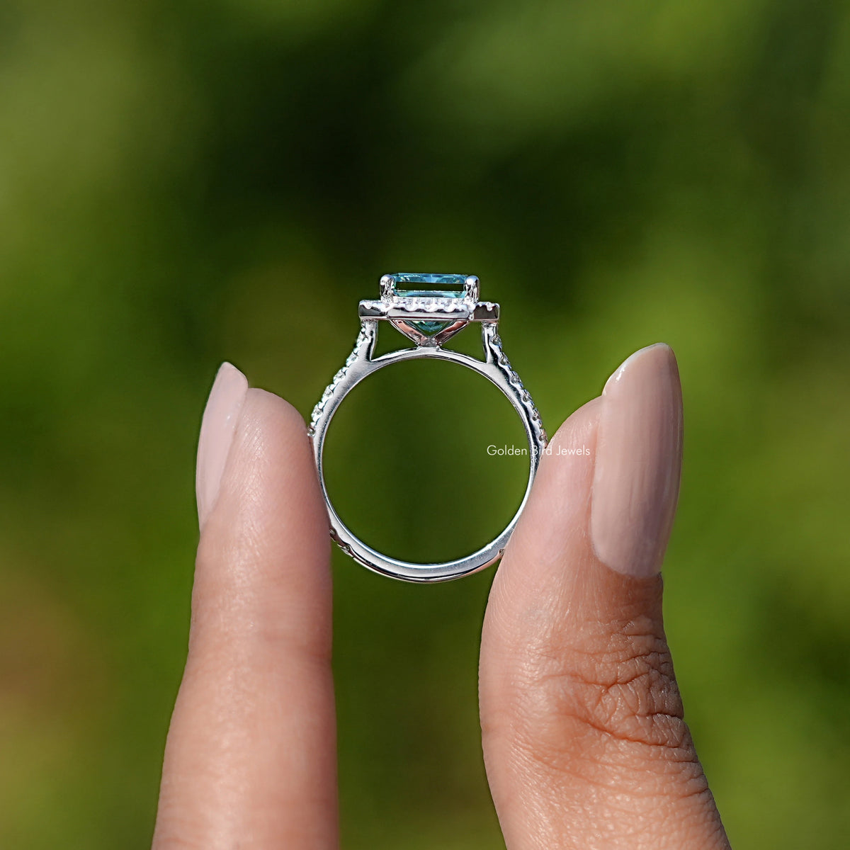 Back view of Blue Green Radiant Cut Moissanite ring in secure setting 