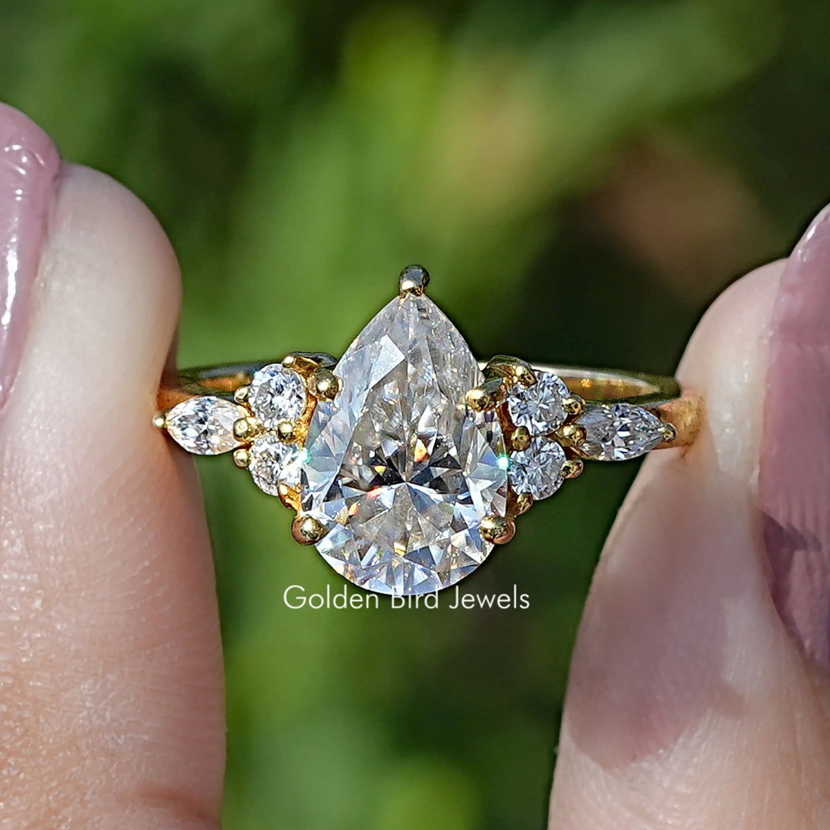 Front view of Pear Shaped Moissanite Accent Engagement Ring