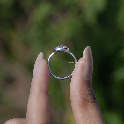 Moissanite solitaire ring with round stone, silver-tone band, four-prong setting